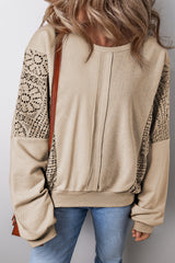 Sweat-shirt en tricot parchemin avec coutures apparentes *