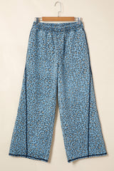 Jean large bleu à imprimé léopard et coutures apparentes avec cordon de serrage
