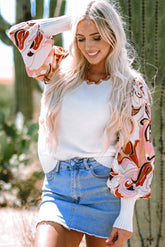 White sweater with bishop sleeves and floral patch