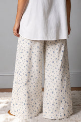 Jean large blanc fleuri à taille haute, double ceinture et cordon