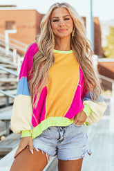 Oversized top with exposed seams and grapefruit orange patchwork