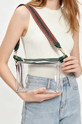 Petit sac transparent à finitions vert foncé et sangle tissée à motifs