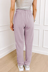 High waist pants with tightening cord and orchid petals, satin striped patch, right leg