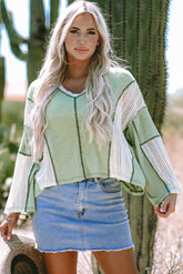 Grass green high low loose top with crochet details and exposed seams