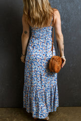 Long frowned dress with ruffles and blue floral sky print