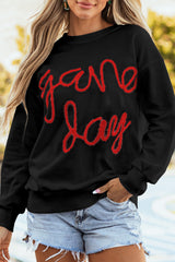 Sweat-shirt graphique noir à épaules tombantes Tinsel Game Day