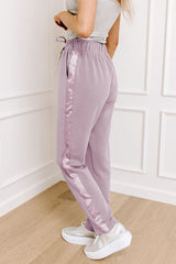High waist pants with tightening cord and orchid petals, satin striped patch, right leg