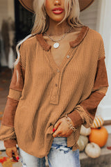Waffle knit henley top with exposed seams and orange contrast patches