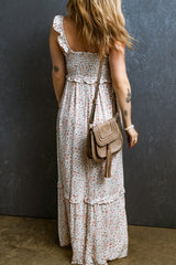 Long floral dress gathered with straps and white lace ruffles