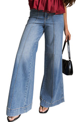 Jean évasé bleu à taille haute, passepoils et coutures apparentes