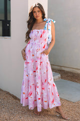 Robe longue smockée rose à imprimé floral et épaules nouées
