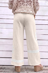 Pantalon large blanc en coton à dentelle florale