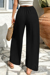 Pantalon ample texturé de couleur unie, couleur noir, taille croisée