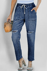 Pantalon de jogging en denim à poches rondes et vieilli bleu foncé