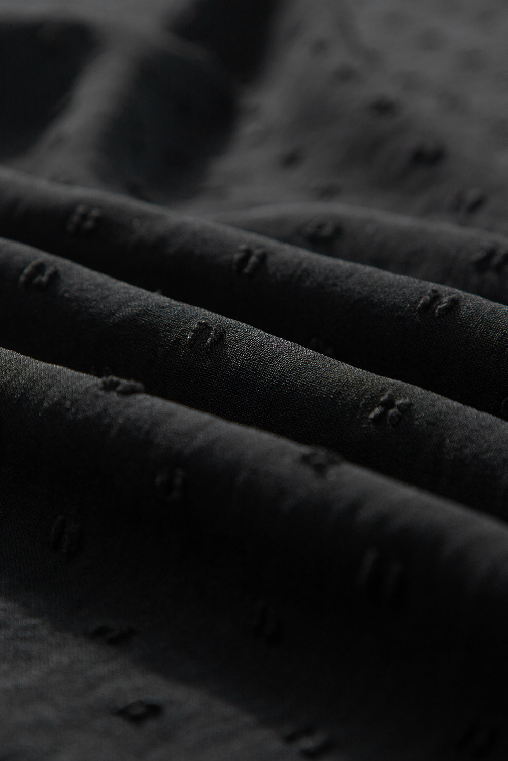 Chemisier noir à pois suisses, col montant, manches chauve-souris-A WOMAN WE LOVE