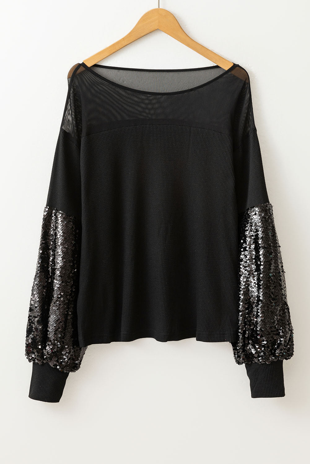 Blouse noire à manches lanternes et patchwork de sequins-A WOMAN WE LOVE