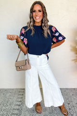 Chemisier bleu voile à col volanté et broderie de coquillages et de corail-A WOMAN WE LOVE