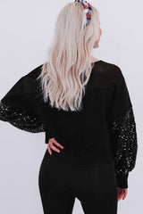 Blouse noire à manches lanternes et patchwork de sequins-A WOMAN WE LOVE