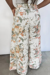 Jean large beige fleuri à taille haute et poches plaquées