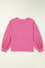 Llamativa sudadera rosa y cuello y hombros