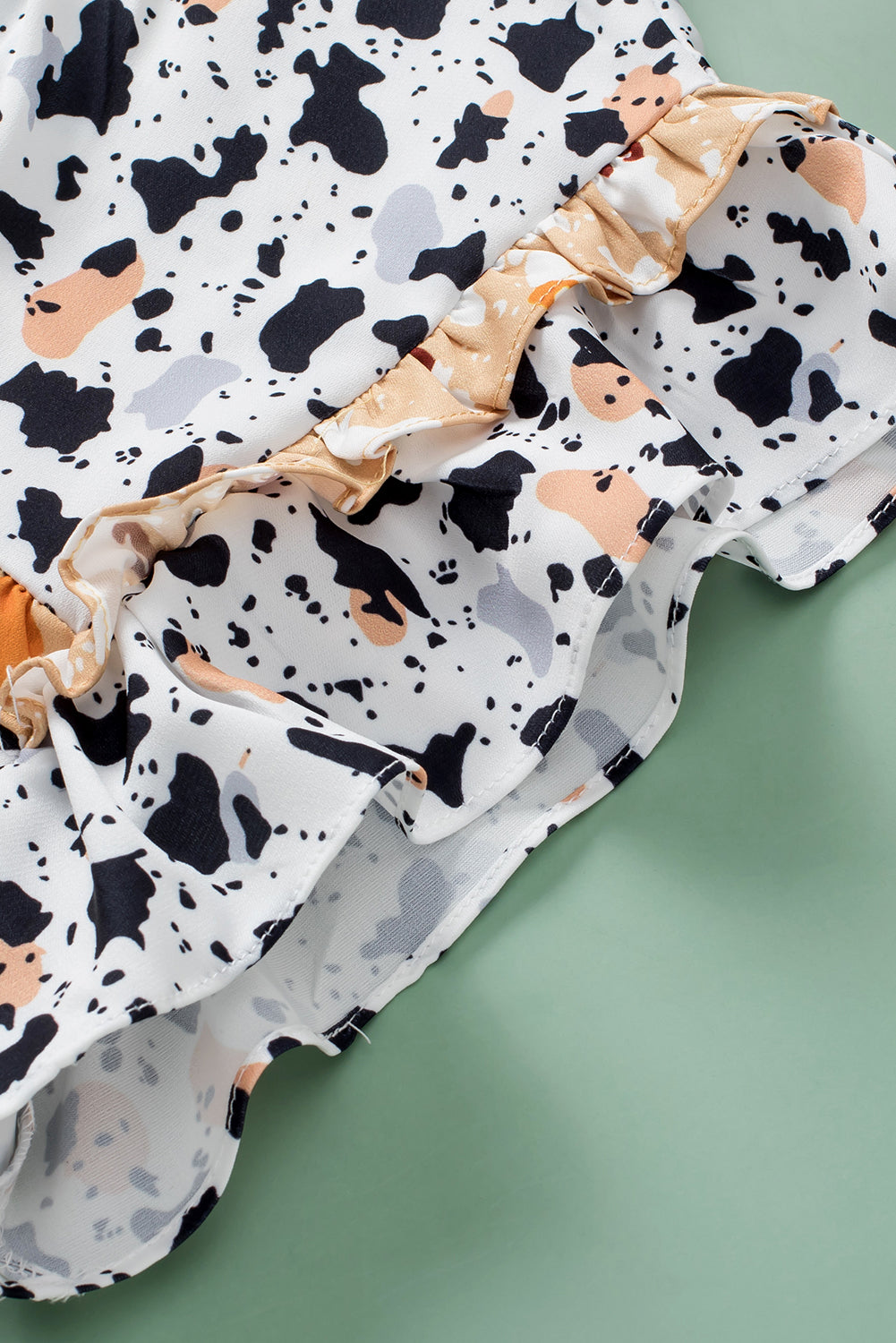 Chemisier blanc à pois et imprimé léopard à volants-A WOMAN WE LOVE