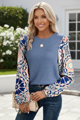 Blue blouse with ruffles and floral sleeves *