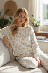 Living room set with white leopard sweater and tightening cord pants
