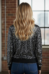 Black short blouse with glitter and round neck with long sleeves