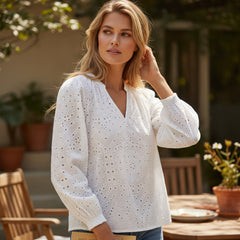 White blog with V -neck and puffed sleeves embroidered with eyelets *