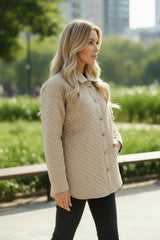 Veste matelassée boutonnée de couleur unie