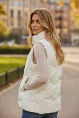 White quilted jacket with high collar and zipper