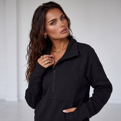 Black sweatshirt with stand-up collar and kangaroo pocket with quarter-turn zip