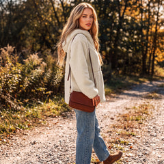 Beige fleece jacket with zipper and drawstring and hooded pockets