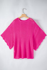 Pull fuchsia en maille ajourée à bords festonnés