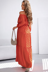 Long orange dress with bare shoulders and ruffled cut -off ball sleeves