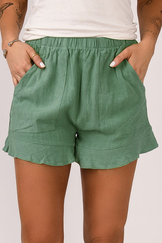 Pantalones cortos verdes con volantes y bolsillos de cintura alta