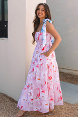 Robe longue smockée rose à imprimé floral et épaules nouées