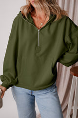 Loose-fitting half-zip hoodie with fleece-lined kangaroo pockets in moss green