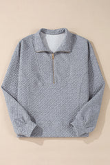 Sudadera gris con media fera éclair textúe uni