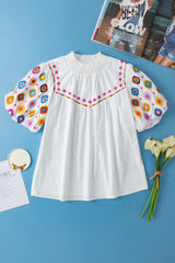 White top embroidered with smocked collar and puffy sleeves