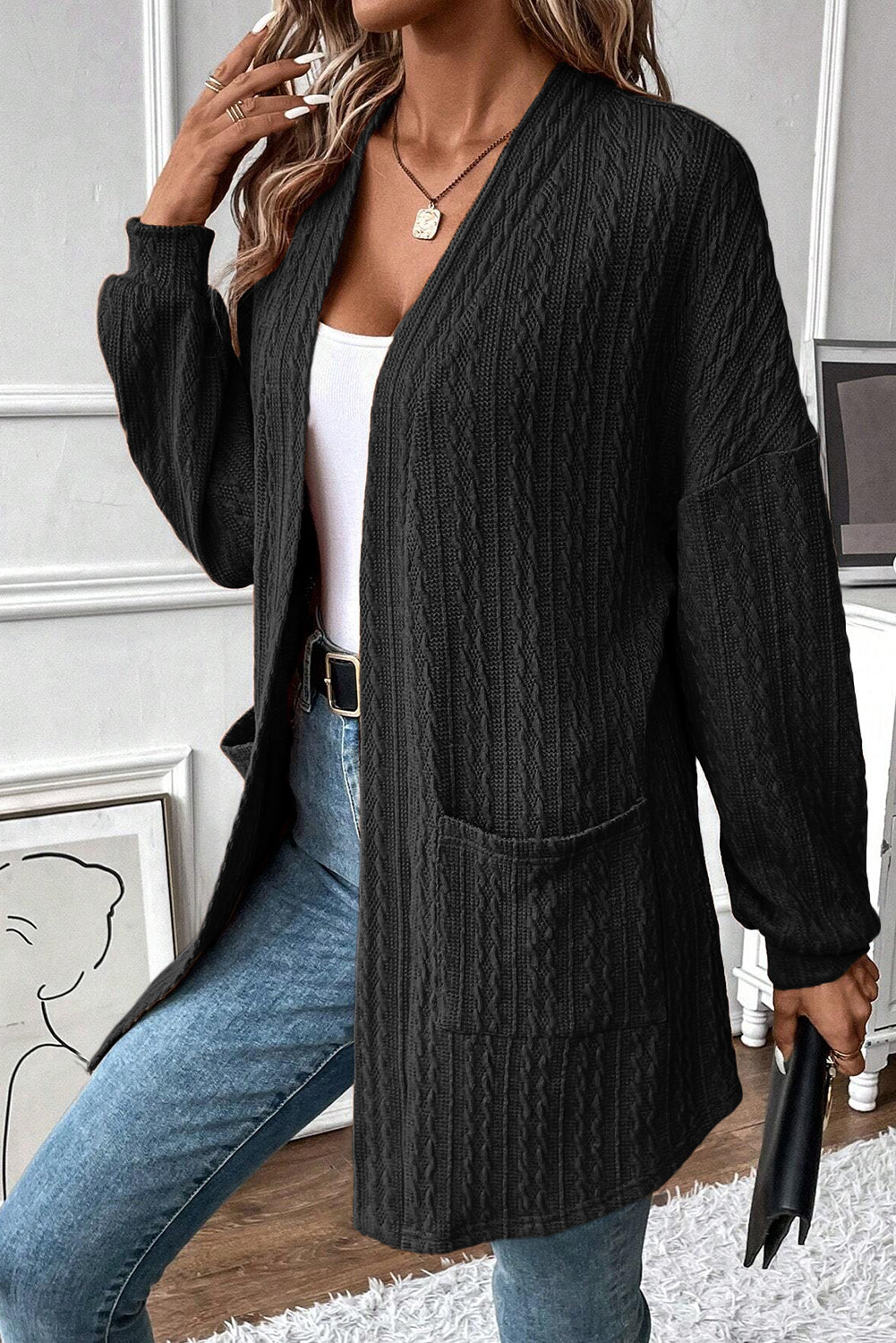 Cardigan noir ouvert sur le devant avec poches latérales en tricot texturé-A WOMAN WE LOVE