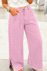 Jean large rose à taille haute, rivets et fentes latérales
