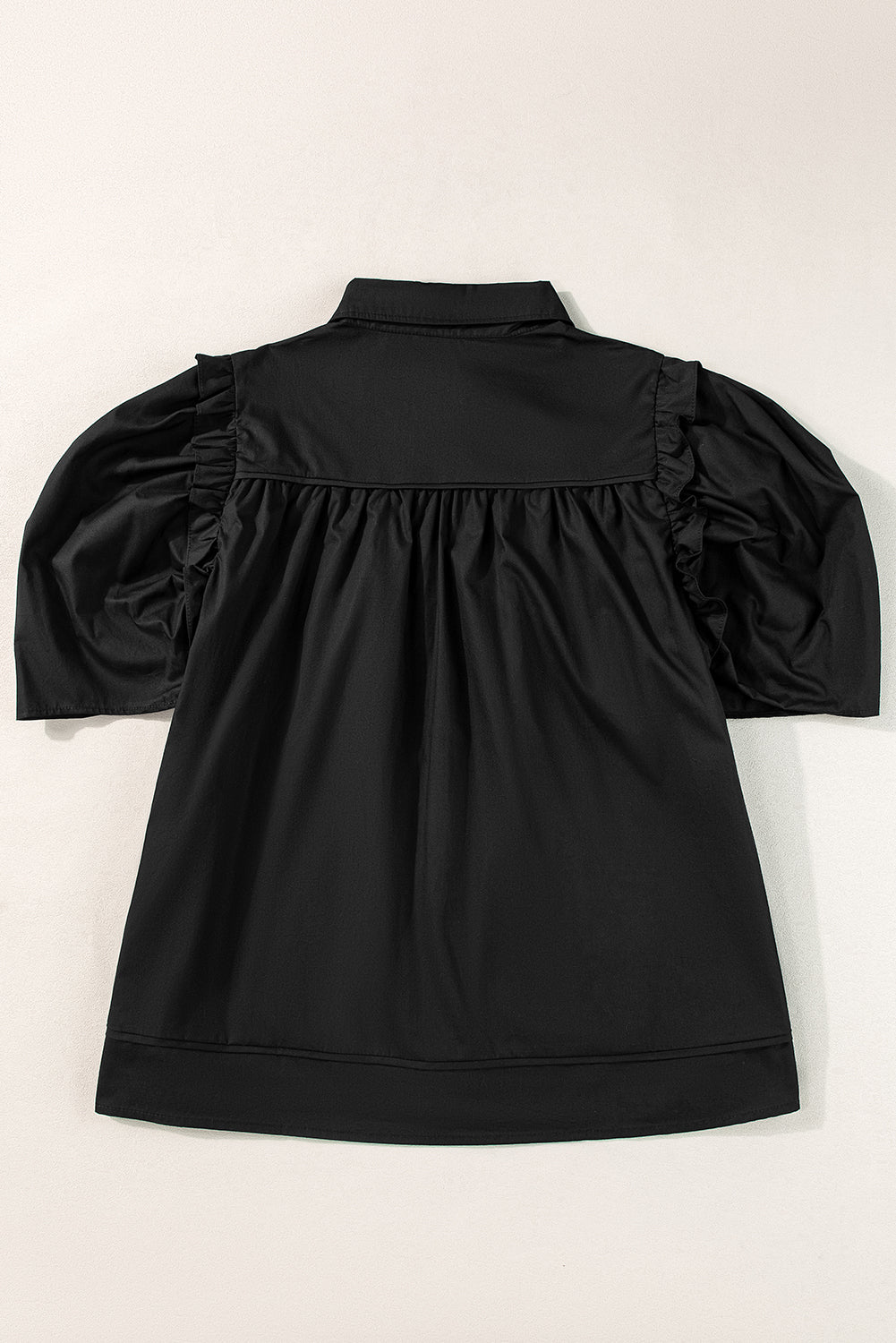 Chemise ample noire à manches bouffantes-A WOMAN WE LOVE