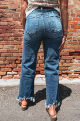 Jean évasé bleu à taille haute et bords effilochés, longueur cheville